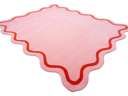 Pink rug with red border 