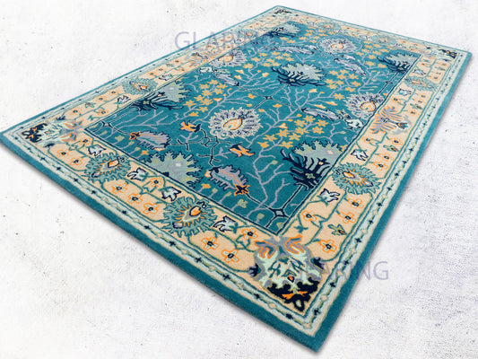 Handmade teal blue Oushak wool rug with orange floral pattern and ivory border traditional area rug