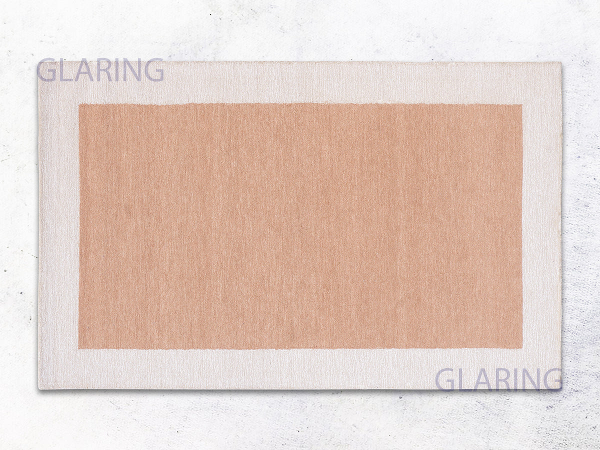 A rectangular rug with a border loop design in rust and ivory colors, with the brand name 'GLARING' visible at the top and bottom.