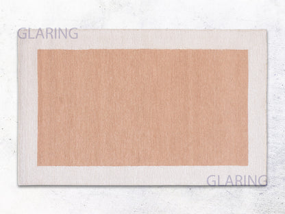 A rectangular rug with a border loop design in rust and ivory colors, with the brand name 'GLARING' visible at the top and bottom.