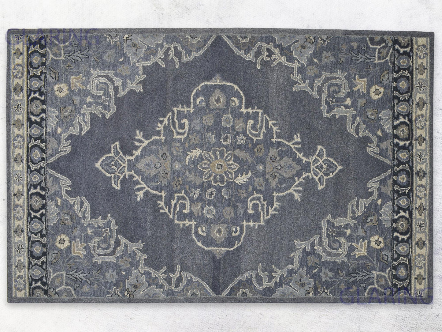 A handcrafted Heriz-Indian area rug with a geometric pattern in gray, ivory, and beige, featuring a medium-cut pile.