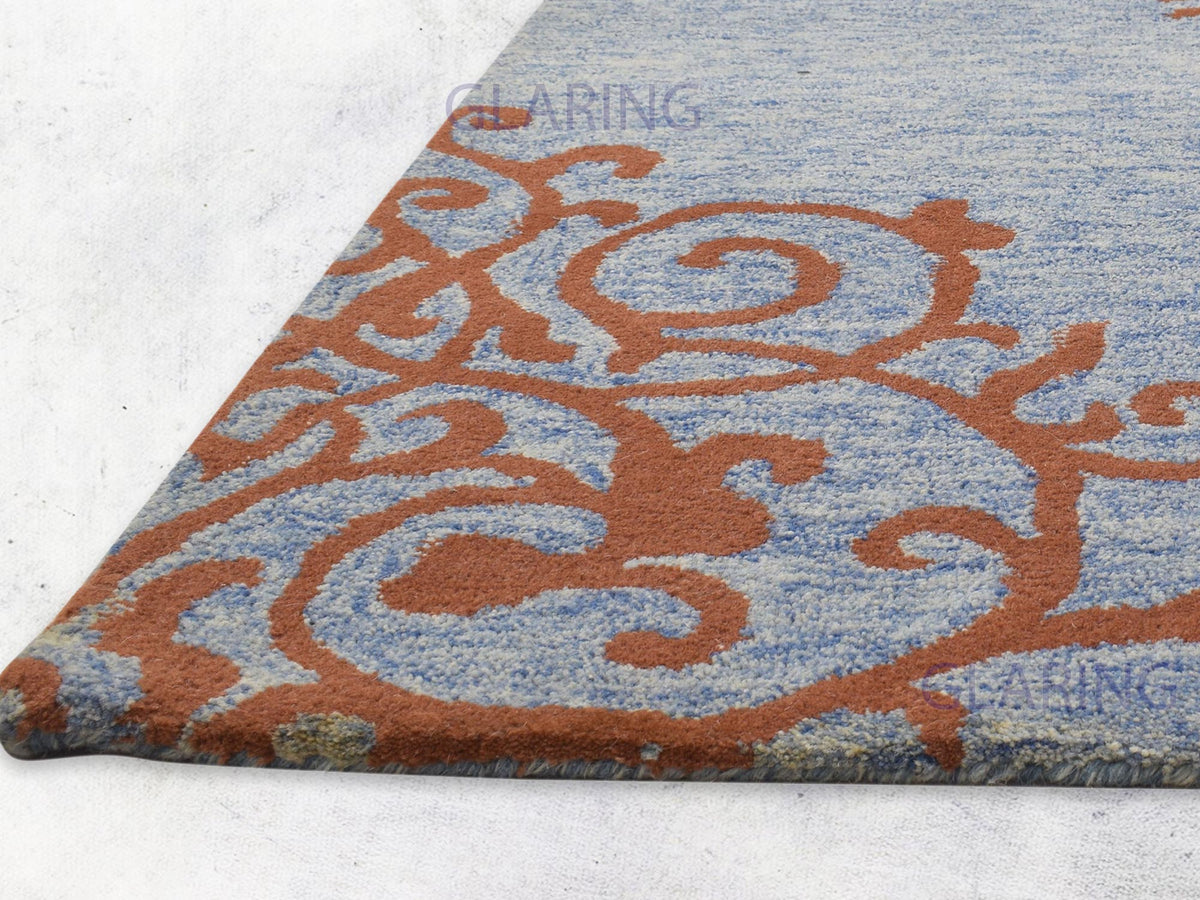 Traditional blue and rust floral rug